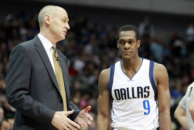 Feb 28, 2015; Dallas, TX, USA; Dallas Mavericks head coach Rick Carlisle (L) talks to guard Rajon Rondo (9) against the Brooklyn Nets at American Airlines Center. Mandatory Credit: Tim Heitman-USA TODAY Sports