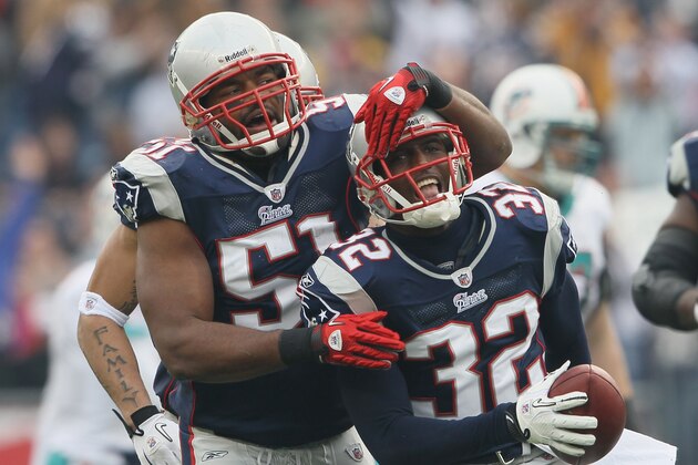 FOXBORO, MA - JANUARY 02: Devin McCourty #32 of the New England Patriots is congratulated by teammate Jerod Mayo #51 after McCourty intercepted a pass by the Miami Dolphins on January 2, 2011 at Gillette Stadium in Foxboro, Massachusetts.  (Photo by Elsa/Getty Images)