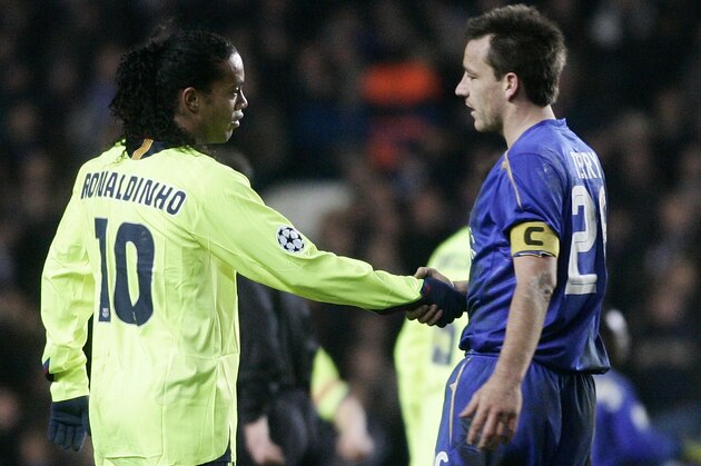 Barcelona player Ronaldinho, from Brazil, left, is congratulated by Chelsea player John Terry after the end their Champions League soccer match at Stamford Bridge stadium in London, Wednesday Feb. 22, 2006. (AP Photo/Manu Fernandez)