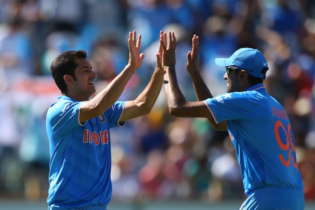 PERTH, AUSTRALIA - MARCH 06: Mohit Sharmar and Ravichandran Ashwin of India celebrate the dismissal of Chris Gayle of the West Indies during the 2015 ICC Cricket World Cup match between India and the West Indies at WACA on March 6, 2015 in Perth, Australia.  (Photo by Paul Kane/Getty Images)