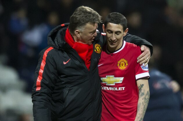 Manchester United's manager Louis van Gaal, left, speaks with Angel Di Maria during the English FA Cup Fifth Round soccer match between Preston and Manchester United at Deepdale Stadium in Preston, England, Monday Feb. 16, 2015.  (AP Photo/Jon Super)