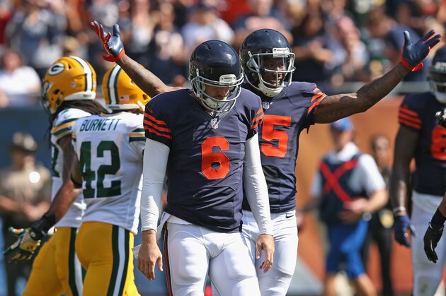 CHICAGO, IL - SEPTEMBER 28:  Brandon Marshall #15 of the Chicago Bears celebrates after Jay Cutler #6 of the Chicago Bears ran for a first down during the first quarter of their game against Green Bay Packers at Soldier Field on September 28, 2014 in Chicago, Illinois. (Photo by Jonathan Daniel/Getty Images)