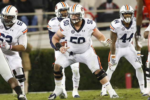 Auburn offensive lineman Reese Dismukes (50) blocks against Georgia in the first half of an NCAA college football game Saturday, Nov. 15, 2014, in Athens, Ga. (AP Photo/John Bazemore)