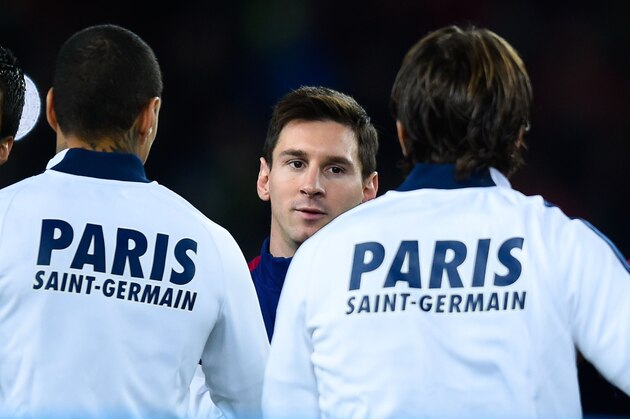 BARCELONA, SPAIN - DECEMBER 10:  Luis Suarez (L) and Lionel Messi of FC Barcelona shake hands with Paris Saint-Germain FC players prior to the UEFA Champions League group F match between FC Barcelona and Paris Saint-Germanin FC at Camp Nou Stadium on December 10, 2014 in Barcelona, Spain.  (Photo by David Ramos/Getty Images)