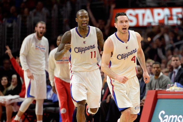 LOS ANGELES, CA - FEBRUARY 19:  J.J. Redick #4 of the Los Angeles Clippers reacts to his three pointer with Jamal Crawford #11 during a 119-115 Clipper win over the San Antonio Spurs at Staples Center on February 19, 2015 in Los Angeles, California.  NOTE TO USER: User expressly acknowledges and agrees that, by downloading and or using this Photograph, user is consenting to the terms and condition of the Getty Images License Agreement.  (Photo by Harry How/Getty Images)