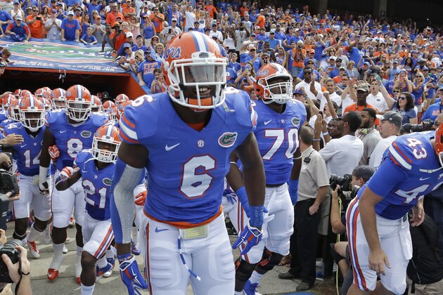 Florida defensive lineman Dante Fowler, Jr. (6) takes the field with teammates before an NCAA college football game against Eastern Michigan in Gainesville, Fla., Saturday, Sept. 6, 2014. (AP Photo/John Raoux)