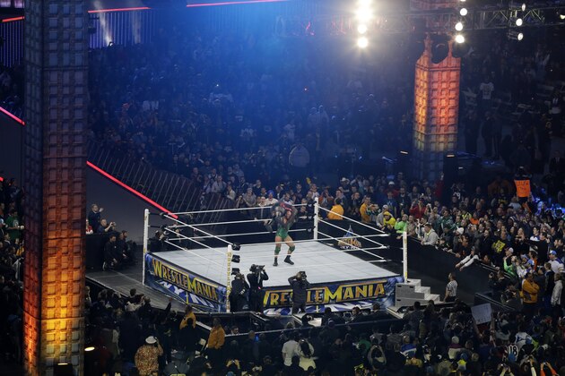 Wrestler Ryan Reeves, known as Ryback,  lifts Mark Henry during their match Sunday, April 7, 2013, in East Rutherford, N.J., during the WWE Wrestlemania 29 event.  (AP Photo/Mel Evans)