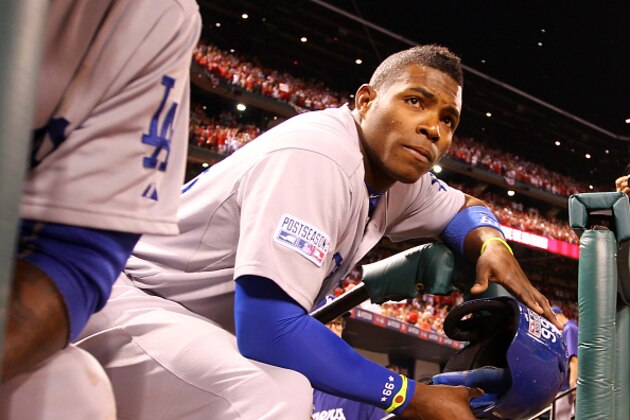ST LOUIS, MO - OCTOBER 07:  Yasiel Puig #66 of the Los Angeles Dodgers looks on from the dugout steps after being defeated by the St. Louis Cardinals in Game Four of the National League Divison Series at Busch Stadium on October 7, 2014 in St Louis, Missouri.  (Photo by Jamie Squire/Getty Images)