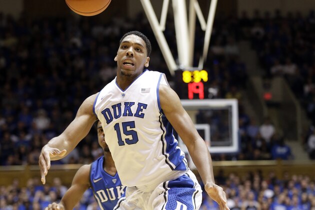 In this Saturday, Oct. 25, 2014, photo, Duke's Jahlil Okafor (15) chases the ball during an NCAA college basketball scrimmage at Cameron Indoor Stadium in Durham, N.C.  With a lineup stacked with four blue-chip freshmen talented enough to jump to the NBA after one year, these Blue Devils look an awful lot like some recent Kentucky teams. (AP Photo/Gerry Broome)