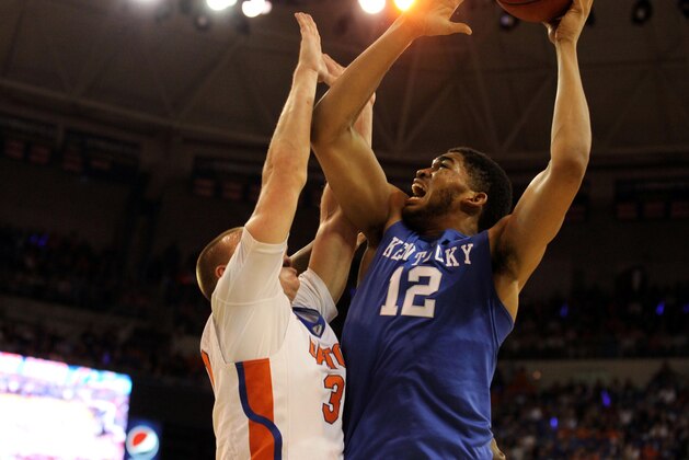 Feb 7, 2015; Gainesville, FL, USA; Kentucky Wildcats forward Karl-Anthony Towns (12) shoots over Florida Gators forward Jacob Kurtz (30) during the second half at Stephen C. O'Connell Center. Kentucky Wildcats defeated the Florida Gators 68-61. Mandatory Credit: Kim Klement-USA TODAY Sports