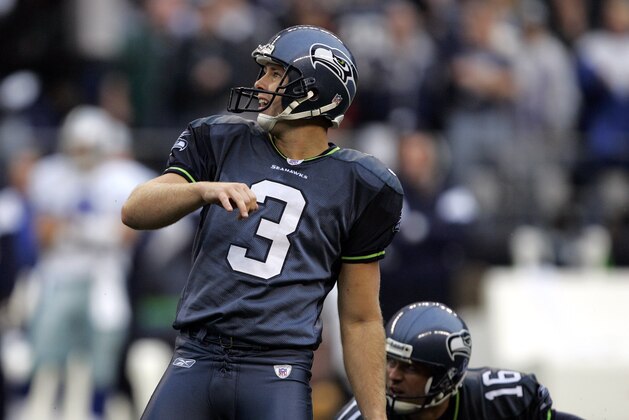 Seattle Seahawks kicker Josh Brown (3) watches the path of his 50-yard field goal attempt against the Dallas Cowboys as holder Tom Rouen looks, Sunday, Oct. 23, 2005, in Seattle. Brown's kick with 5 seconds remaining in the game was good, giving the Seahawks a 13-10 victory. (AP Photo/Elaine Thompson)