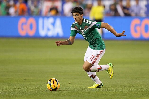 GLENDALE, AZ - APRIL 02:  Alan Pulido #11 of Mexico handles the ball during the International Friendly against USA at University of Phoenix Stadium on April 2, 2014 in Glendale, Arizona. Mexico and USA played to a 2-2 tie.  (Photo by Christian Petersen/Getty Images)