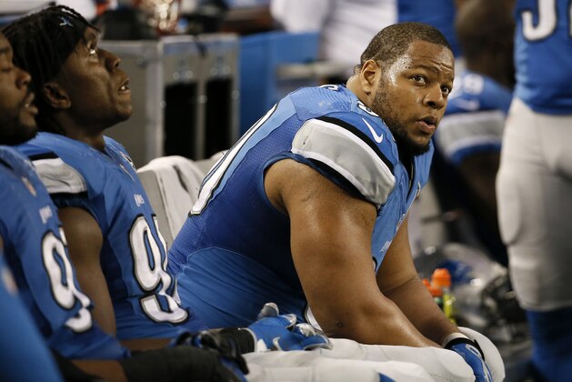 Detroit Lions defensive tackle Ndamukong Suh (90) watches action from the sideline during the second half of an NFL wildcard playoff football game against the Dallas Cowboys, Sunday, Jan. 4, 2015, in Arlington, Texas. (AP Photo/Tony Gutierrez)