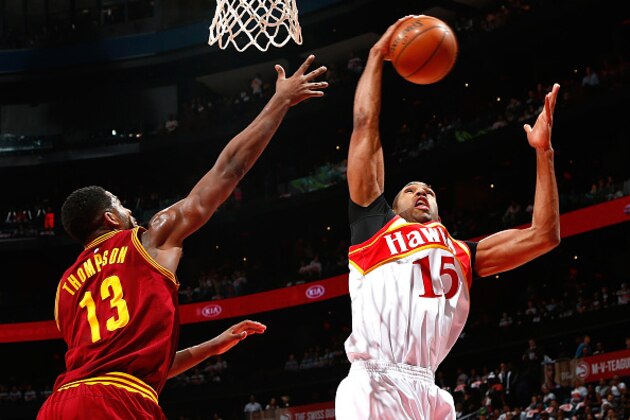 ATLANTA, GA - MARCH 06:  Al Horford #15 of the Atlanta Hawks grabs a rebound against Tristan Thompson #13 of the Cleveland Cavaliers at Philips Arena on March 6, 2015 in Atlanta, Georgia.  NOTE TO USER: User expressly acknowledges and agrees that, by downloading and/or using this photograph, user is consenting to the terms and conditions of the Getty Images License Agreement.  (Photo by Kevin C. Cox/Getty Images)