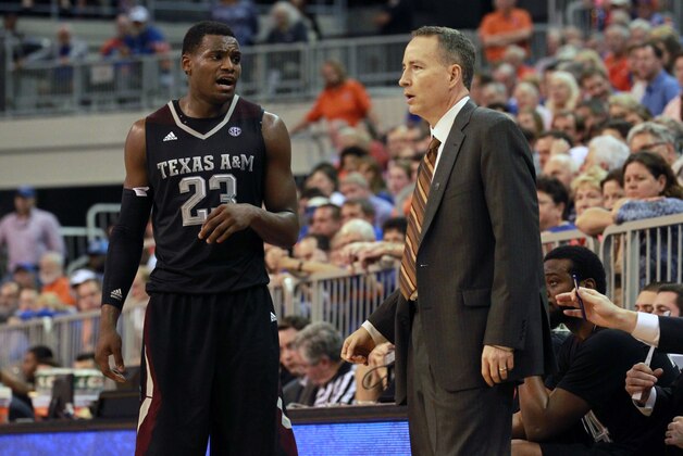 Mar 3, 2015; Gainesville, FL, USA; Texas A&M Aggies head coach Billy Kennedy talks with guard Danuel House (23) against the Florida Gators during the second half at Stephen C. O'Connell Center. Florida Gators defeated the Texas A&M Aggies 66-62. Mandatory Credit: Kim Klement-USA TODAY Sports