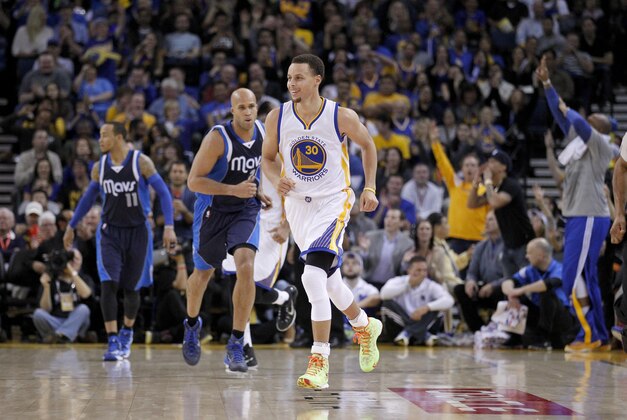 Mar 6, 2015; Oakland, CA, USA; Golden State Warriors guard Stephen Curry (30) reacts after making a shot against the Dallas Mavericks in the second quarter at Oracle Arena. Mandatory Credit: Cary Edmondson-USA TODAY Sports