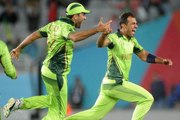 Pakistan's Wahab Riaz, right, celebrates with teammate Sohail Khan, left, as they celebrate their 29 run win over South Africa in their Cricket World Cup Pool B match in Auckland, New Zealand, Saturday, March 7, 2015. (AP Photo/Ross Setford)