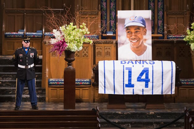 CHICAGO, IL - JANUARY 30:  A soldier guards the remains of Ernie Banks during his visitation at the Fourth Presbyterian Church on January 30, 2015 in Chicago, Illinois. Banks, who was known as Mr. Cub, played with the Chicago Cubs from 1953 through 1971, joining the team after a short stint with the Negro League. Banks, considered by many to be one of the sport's greatest players, was inducted into the National Baseball Hall of Fame in 1977. He died on January 23rd of a heart attack, eight days before his 84th birthday.  (Photo by Scott Olson/Getty Images)
