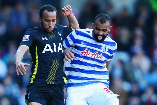 LONDON, ENGLAND - MARCH 07:  Andros Townsend of Spurs battles with Sandro of QPR during the Barclays Premier League match between Queens Park Rangers and Tottenham Hotspur at Loftus Road on March 7, 2015 in London, England.  (Photo by Paul Gilham/Getty Images)