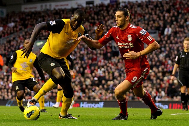 LIVERPOOL, ENGLAND - DECEMBER 26:  Christopher Samba of Blackburn (L) in action with Andy Carroll of Liverpool during the Barclays Premier League match between Liverpool and Blackburn Rovers at Anfield on December 26, 2011 in Liverpool, England.  (Photo by Scott Heavey/Getty Images)