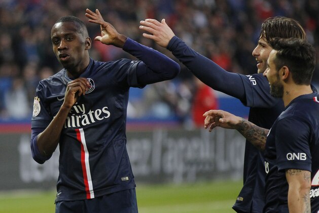 PSG's Blaise Matuidi, left, celebrates scoring with his teammates PSG's Uruguayan Edinson Cavani, center, and PSG's Argentinian Ezequiel Lavezzi, during a League One soccer match Paris Saint Germain against Lens at Parc des Prince stadium in Paris, France, Saturday, March 7, 2015. Paris Saint Germain won 4-1. (AP Photo/Michel Euler)