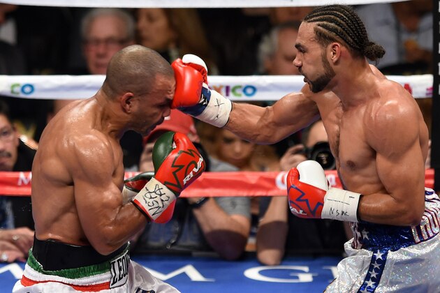LAS VEGAS, NV - DECEMBER 13:  Keith Thurman (R) hits Leonard Bundu in the fourth round of their WBA interim welterweight title fight at the MGM Grand Garden Arena on December 13, 2014 in Las Vegas, Nevada. Thurman retained his title by unanimous decision.  (Photo by Ethan Miller/Getty Images)