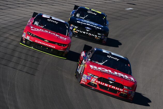 LAS VEGAS, NV - MARCH 07: Chris Buescher, driver of the #60 Roush Performance Products Ford, leads Dale Earnhardt Jr., driver of the #88 Taxslayer.com Chevrolet, and Darrell Wallace Jr., driver of the #6 Ford Ecoboost Ford, during the NASCAR XFINITY Series Boyd Gaming 300 at Las Vegas Motor Speedway on March 7, 2015 in Las Vegas, Nevada.  (Photo by Robert Laberge/Getty Images)