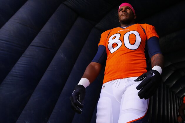 Denver Broncos tight end Julius Thomas looks to the crowd before taking the field during an NFL football game between the Denver Broncos and the Arizona Cardinals, Sunday, Oct. 5, 2014, in Denver. (AP Photo/Jack Dempsey)