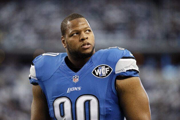 Detroit Lions defensive tackle Ndamukong Suh (90) warms up before an NFL wildcard playoff football game against the Dallas Cowboys, Sunday, Jan. 4, 2015, in Arlington, Texas. (AP Photo/Tony Gutierrez)