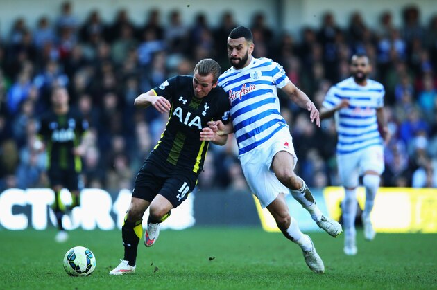 LONDON, ENGLAND - MARCH 07:  Harry Kane of Spurs holds off Steven Caulker of QPR during the Barclays Premier League match between Queens Park Rangers and Tottenham Hotspur at Loftus Road on March 7, 2015 in London, England.  (Photo by Paul Gilham/Getty Images)