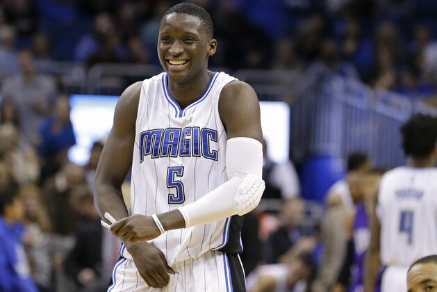 Orlando Magic's Victor Oladipo (5) smiles as Sacramento Kings' Andre Miller, right, reacts after the Magic picked off an inbounds pass to deny the Kings a chance to score in the final seconds of an NBA basketball game, Friday, March 6, 2015, in Orlando, Fla. Orlando won 119-114. (AP Photo/John Raoux)