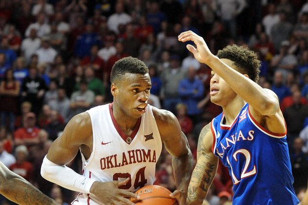 Mar 7, 2015; Norman, OK, USA; ; Oklahoma Sooners guard Buddy Hield (24)  drives to the basket against Kansas Jayhawks guard Kelly Oubre Jr. (12) during the second half at Lloyd Noble Center. Mandatory Credit: Mark D. Smith-USA TODAY Sports