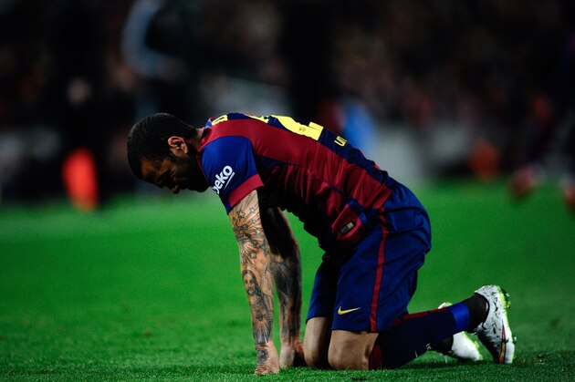 BARCELONA, SPAIN - FEBRUARY 01:  Dani Alves of FC Barcelona reacts during the La Liga match between FC Barcelona and Villarreal CF at Camp Nou on February 1, 2015 in Barcelona, Spain.  (Photo by David Ramos/Getty Images)