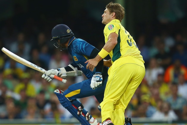 SYDNEY, AUSTRALIA - MARCH 08:  Kumar Sangakkara of Sri Lanka and Shane Watson of Australia collide during the 2015 ICC Cricket World Cup match between Australia and Sri Lanka at Sydney Cricket Ground on March 8, 2015 in Sydney, Australia.  (Photo by Mark Kolbe/Getty Images)