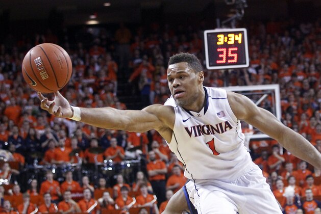 Virginia guard Justin Anderson goes after a rebound during the first half of an NCAA college basketball game against Duke in Charlottesville, Va., on Saturday, Jan. 31, 2015. (AP Photo/Ryan M. Kelly)