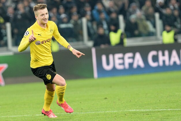 Borussia Dortmund Marco Reus celebrates after scoring during the Champions League round of 16 first leg soccer match between Juventus and Borussia Dortmund at the Juventus Stadium, in Turin, Italy, Tuesday, Feb. 24, 2015. (AP Photo/ Massimo Pinca)