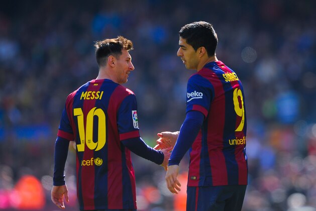 BARCELONA, SPAIN - MARCH 08:  Luis Suarez (R) of FC Barcelona celebrates with his teammate Lionel Messi of FC Barcelona after scoring the opening goal during the La Liga match between FC Barcelona and Rayo Vallecano de Madrid at Camp Nou on March 8, 2015 in Barcelona, Spain.  (Photo by David Ramos/Getty Images)