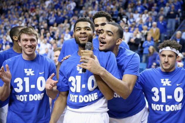 LEXINGTON, KY - MARCH 07:  Andrew Harrison #5 (left) and Trey Lyles #41 (right) of the Kentucky Wildcats talk to the crowd following the game against the Florida Gators at Rupp Arena on March 7, 2015 in Lexington, Kentucky. Kentucky won 67-50 to finish the regular 31-0.  (Photo by Andy Lyons/Getty Images)