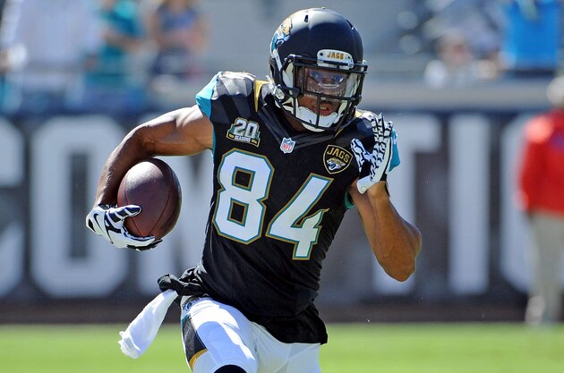 Oct 26, 2014; Jacksonville, FL, USA; Jacksonville Jaguars wide receiver Cecil Shorts III (84) runs with the ball against the Miami Dolphins at EverBank Field. Mandatory Credit: Melina Vastola-USA TODAY Sports