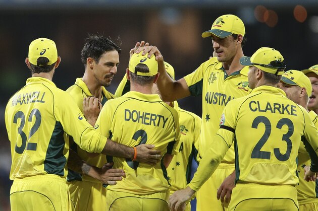 Australia’s Xavier Doherty, third left, celebrates after he took a catch to dismiss Sri Lanka’s Thisara Perera during their Cricket World Cup Pool A match in Sydney, Australia, Sunday, March 8, 2015. (AP Photo/Rob Griffith)
