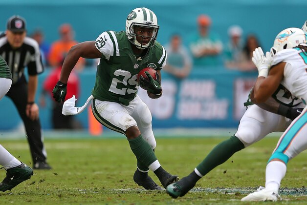 MIAMI GARDENS, FL - DECEMBER 29: Bilal Powell #29 of the New York Jets rushes during a game against the Miami Dolphins at Sun Life Stadium on December 29, 2013 in Miami Gardens, Florida.  (Photo by Mike Ehrmann/Getty Images)