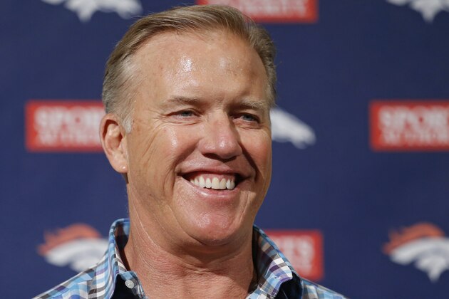 Denver Broncos vice president John Elway smiles as he talks about this weeks NFL football draft during a news conference at the team's headquarters in Englewood, Colo., on Monday, May 5, 2014. (AP Photo/Ed Andrieski)