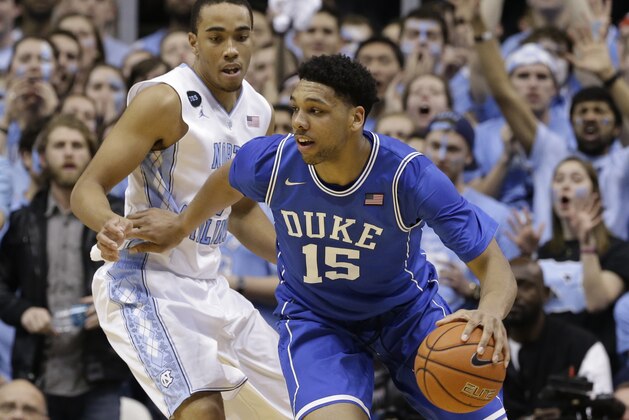 North Carolina's Brice Johnson guards Duke's Jahlil Okafor (15) during the first half of an NCAA college basketball game Saturday, March 7, 2015 in Chapel Hill, N.C. (AP Photo/Gerry Broome)
