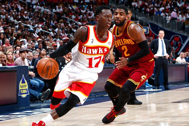 ATLANTA, GA - MARCH 06:  Dennis Schroder #17 of the Atlanta Hawks drives against Kyrie Irving #2 of the Cleveland Cavaliers at Philips Arena on March 6, 2015 in Atlanta, Georgia.  NOTE TO USER: User expressly acknowledges and agrees that, by downloading and/or using this photograph, user is consenting to the terms and conditions of the Getty Images License Agreement.  (Photo by Kevin C. Cox/Getty Images)
