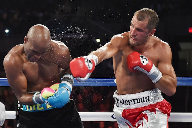 ATLANTIC CITY, NJ - NOVEMBER 08:  Sergey Kovalev punches Bernard Hopkins during their IBF, WBA, & WBO Light Heavyweight title fight at Boardwalk Hall Arena on November 8, 2014 in Atlantic City, New Jersey.  (Photo by Al Bello/Getty Images)