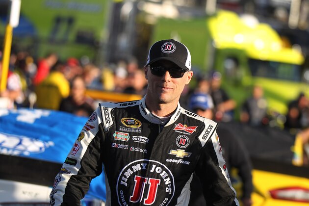 Kevin Harvick walks to pit road before qualifying for Sunday's NASCAR Sprint Cup Series auto race Friday, March 6, 2015, in Las Vegas. (AP Photo/Isaac Brekken)