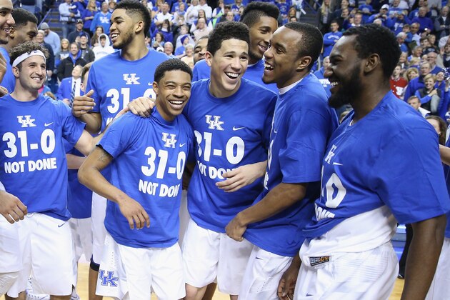 LEXINGTON, KY - MARCH 07:  Tyler Ulis #3, Devin Booker #1, EJ Floreal #24 and Dominique Hawkins #25 of the Kentucky Wildcats celebrate following the game against the Florida Gators at Rupp Arena on March 7, 2015 in Lexington, Kentucky. Kentucky won 67-50 to finish the regular 31-0.  (Photo by Andy Lyons/Getty Images)