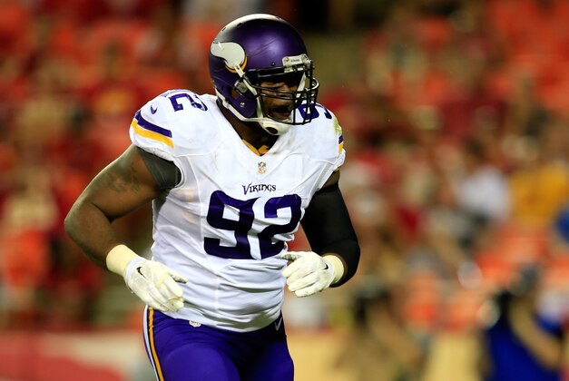 KANSAS CITY, MO - AUGUST 23:  Tom Johnson #92 of the Minnesota Vikings reacts after making a sack during the preseason game against the Kansas City Chiefs at Arrowhead Stadium on August 23, 2014 in Kansas City, Missouri.  (Photo by Jamie Squire/Getty Images)