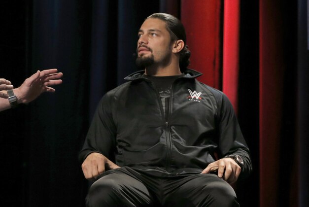 WWE Hall of Famer Stone Cold Steve Austin and WWE Superstar Roman Reigns attend the SummerSlam Confidential Panel at Club Nokia, on Saturday, August 16, 2014 in Los Angeles. (Photo by Todd Williamson/Invision for 2K/AP Images)