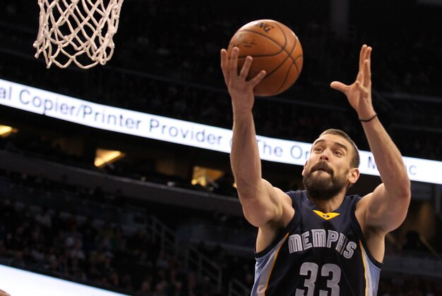 Jan 16, 2015; Orlando, FL, USA; Memphis Grizzlies center Marc Gasol (33) grabs a rebound against the Orlando Magic during the second quarter at Amway Center. Mandatory Credit: Kim Klement-USA TODAY Sports